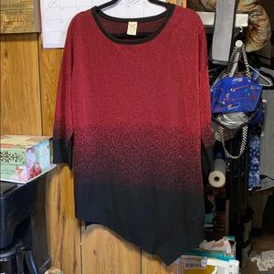 Woman’s dress sweater with sparkles in it.